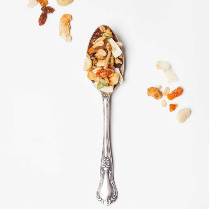 Brookfarm Toasted Muesli Macadamia Apricot Coconut on a spoon