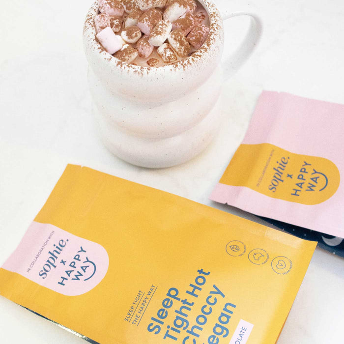 Happy Way Sleep Tight Hot Choccy Vegan & Whey Packets with a mug of hot chocolate